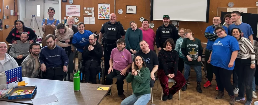 a large group of people gather together for a photo